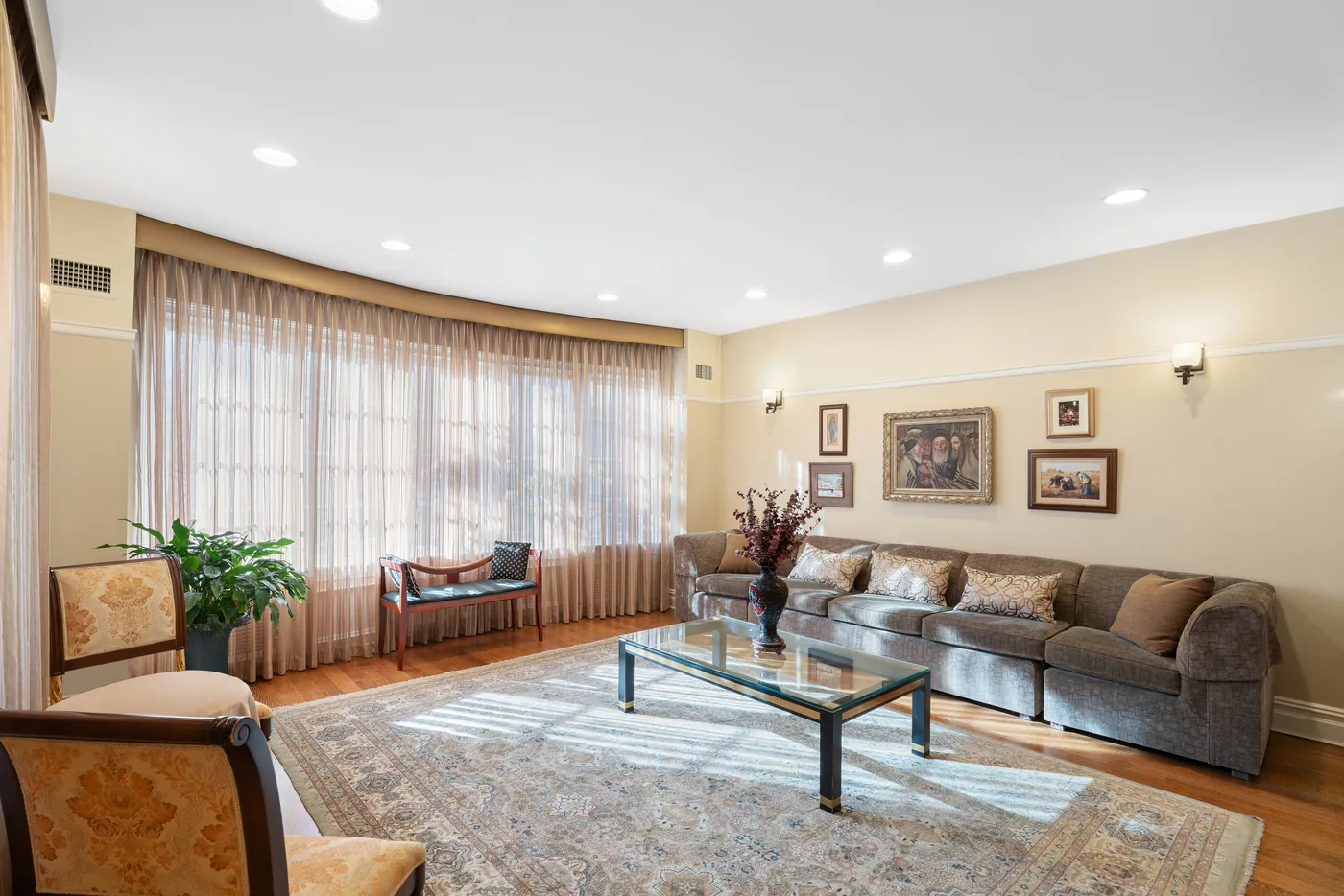 Traditional living room with window treatments photographed for a New York City real estate listing.